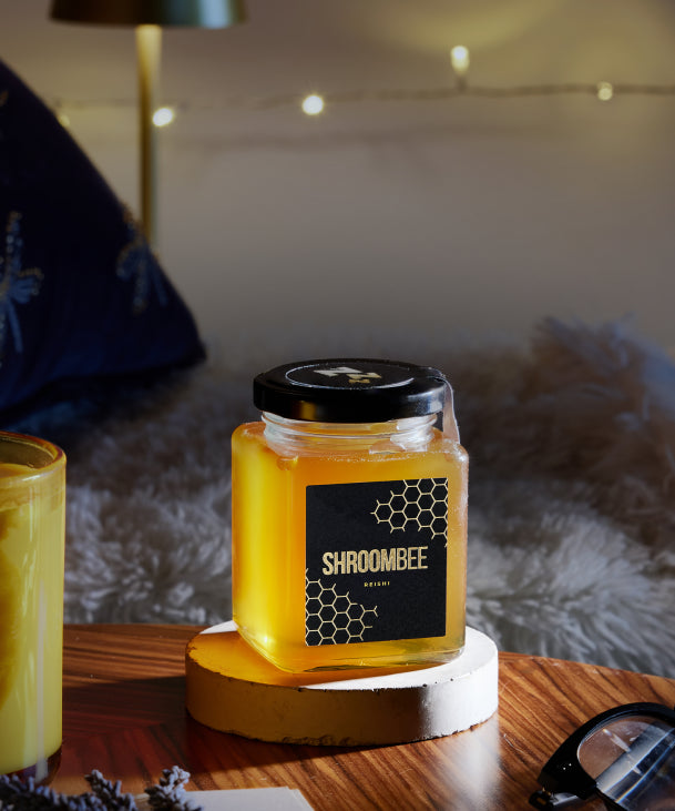 Jar of honey with a black lid 